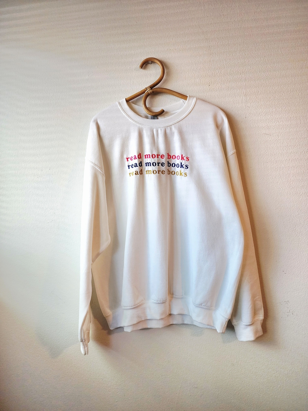 Gildan White Crewneck Sweatshirt with Multicolor 'read more books' Embroidery